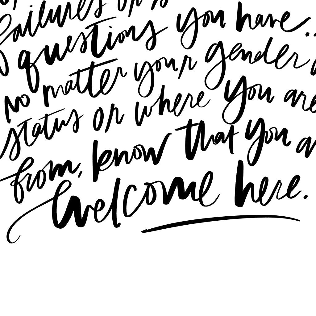 design details of welcome here manifesto calligraphy in white