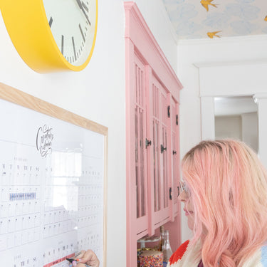 Lindsay writing on the Typography Perpetual calendar