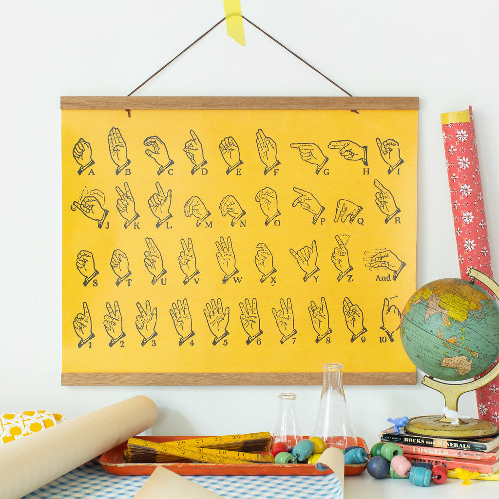 american sign language alphabet in vintage yellow with hanging canvas and kit in teak